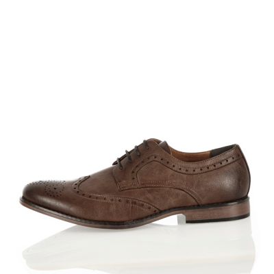 Dark brown wingtip formal shoes